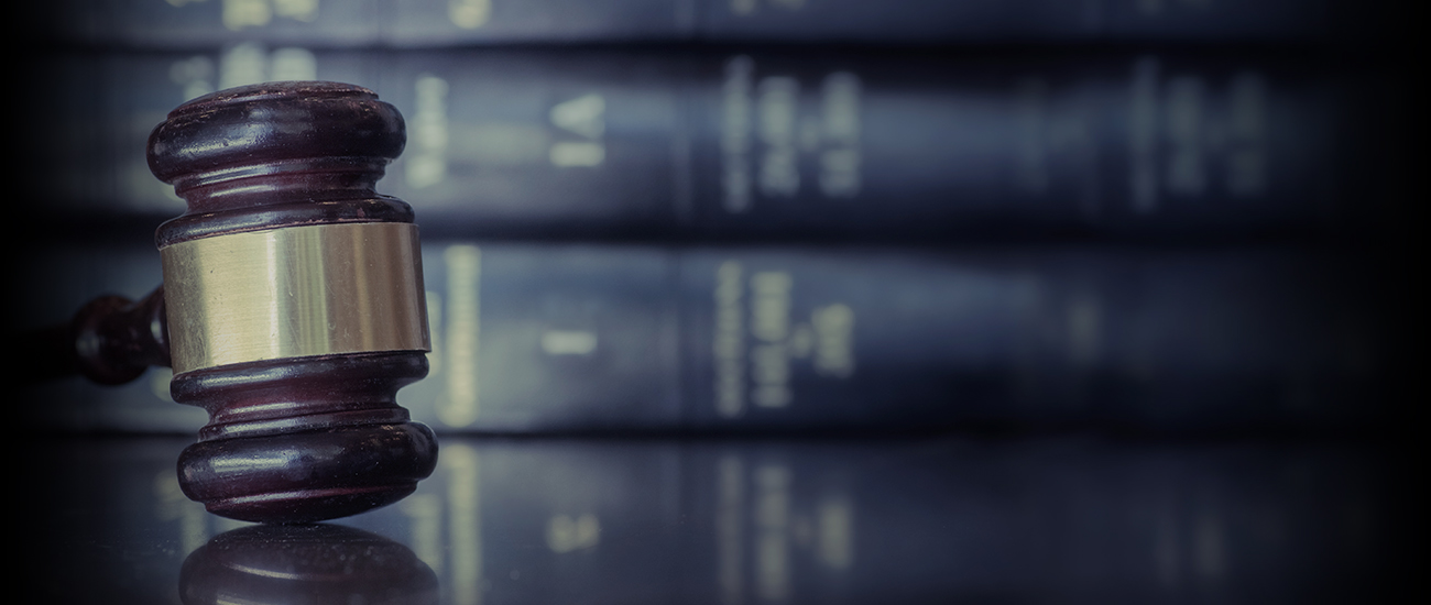 Gavel in front of stacked books