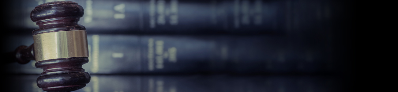 Gavel in front of stacked books